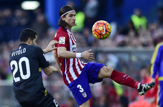 Filipe battles for the ball with Vitolo, who was sent off for Sevilla