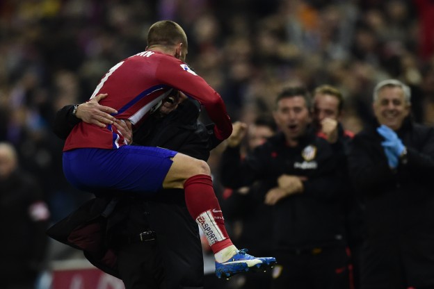 Griezmann leaps on Simeone after scoring the winner versus Athletic