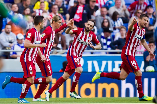 Torres celebrates scoring with Koke and Juanfran